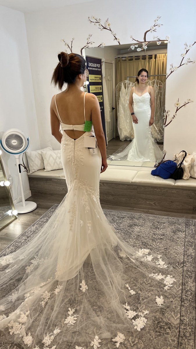 Joelle trying on the first wedding dress at The Brides Project
