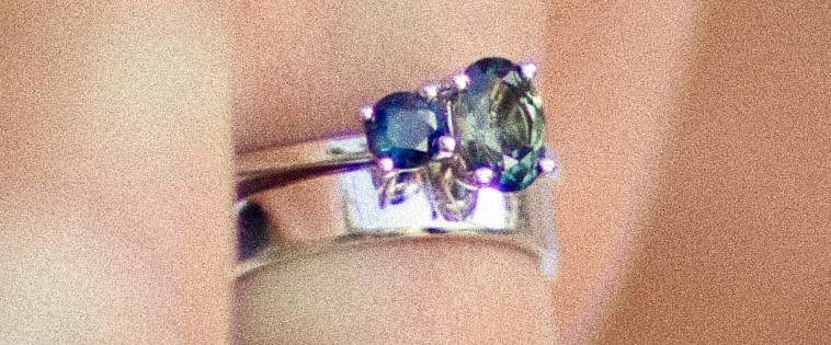 The Parti sapphire ring, showing the green and blue tones of the stone